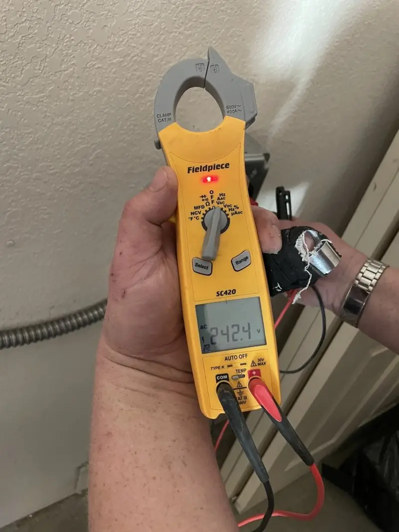 Voltage testing with clamp meter during Recessed Lighting Installation in Shiprock